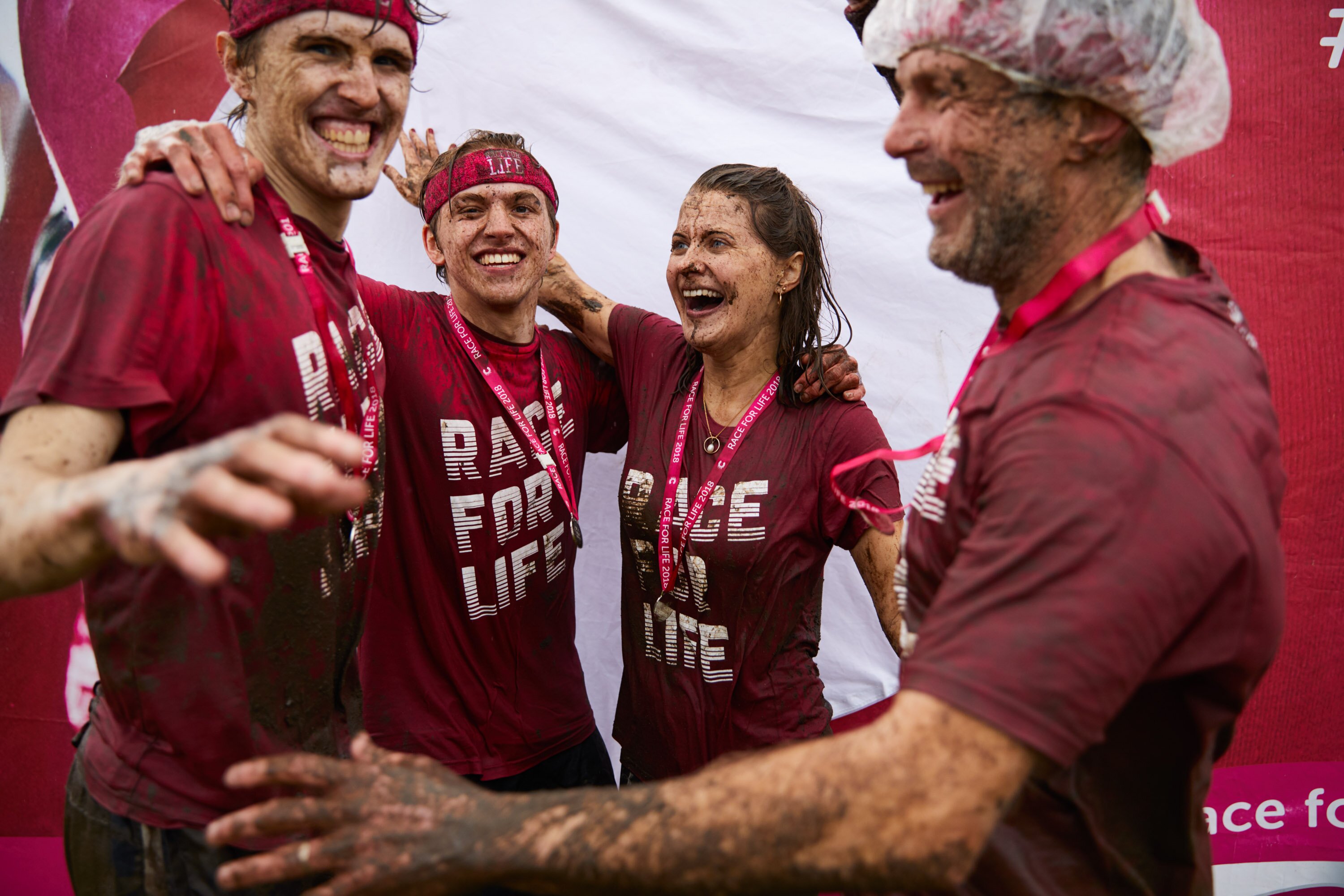 Participants taking part in the Muddy Runs Cancer Research UK Race for Life Pretty Muddy 5k 2020