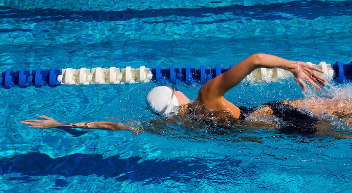 Swimmer in the swimming pool burning calories